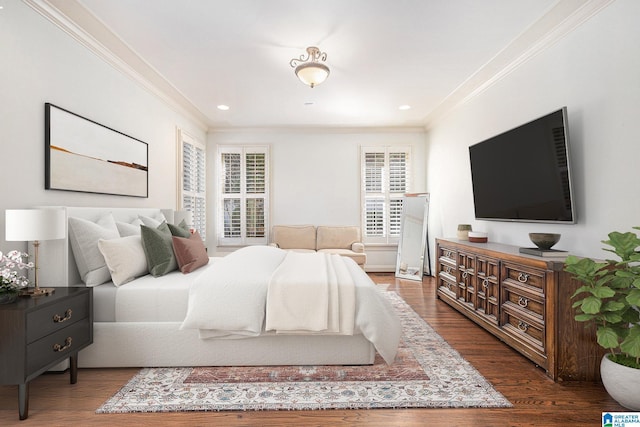 bedroom featuring ornamental molding and dark hardwood / wood-style flooring