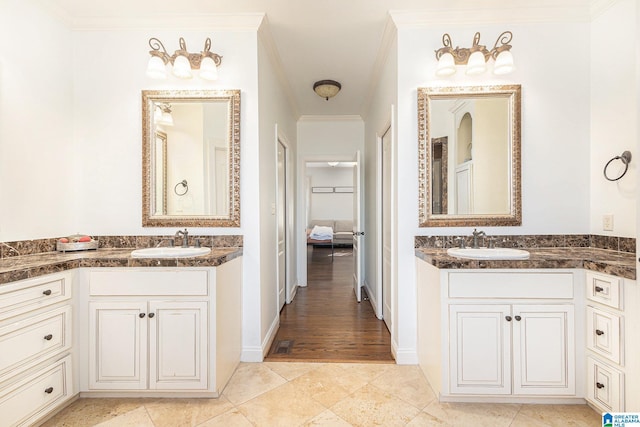 bathroom with vanity and crown molding