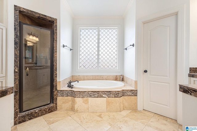 bathroom featuring crown molding, separate shower and tub, and sink