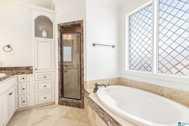 bathroom with ornamental molding, separate shower and tub, and vanity