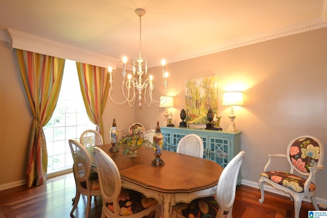 dining room with hardwood / wood-style flooring, crown molding, and a chandelier