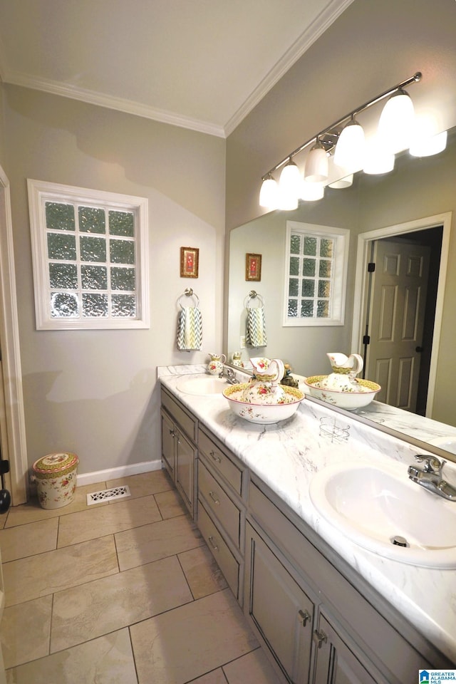 bathroom featuring vanity, tile patterned flooring, and crown molding