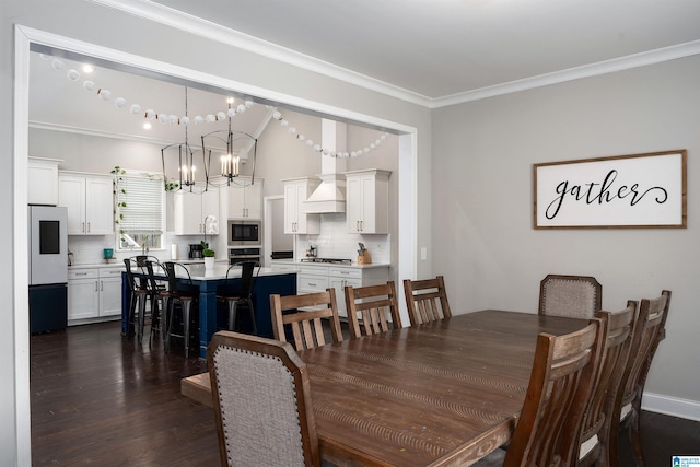 dining space featuring ornamental molding, dark hardwood / wood-style floors, and a chandelier