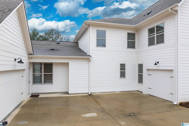 view of side of home featuring a garage