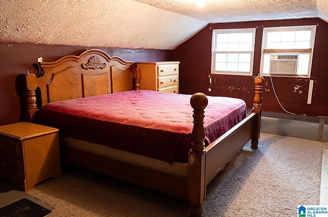 bedroom featuring cooling unit, lofted ceiling, and a textured ceiling