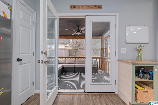 doorway to outside with ceiling fan and hardwood / wood-style floors