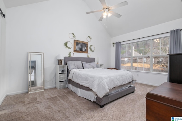 carpeted bedroom featuring ceiling fan and high vaulted ceiling