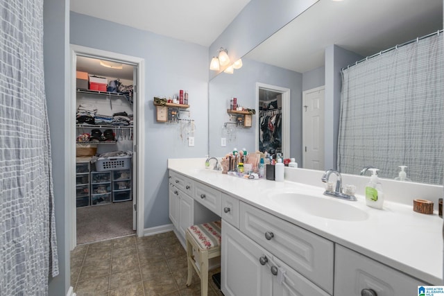 bathroom with vanity and tile patterned floors