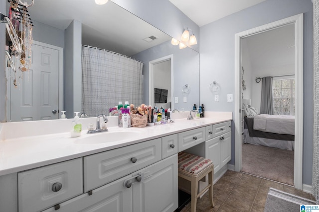 bathroom featuring vanity and tile patterned flooring