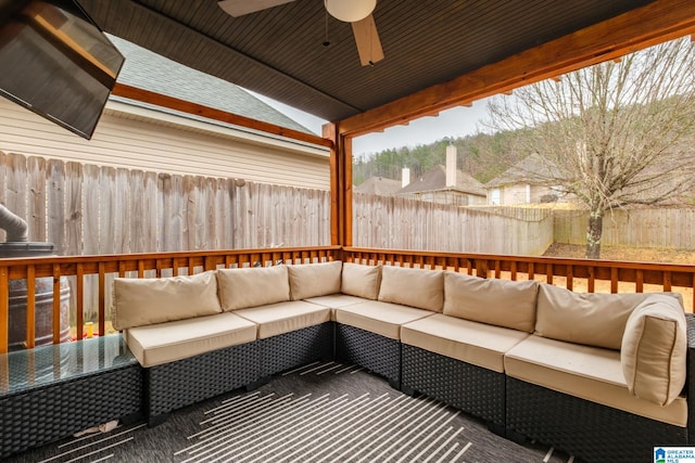 wooden deck featuring an outdoor hangout area and ceiling fan