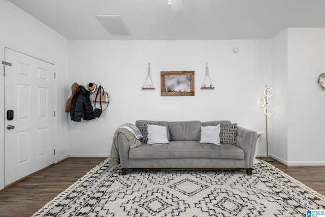 living room featuring dark wood-type flooring