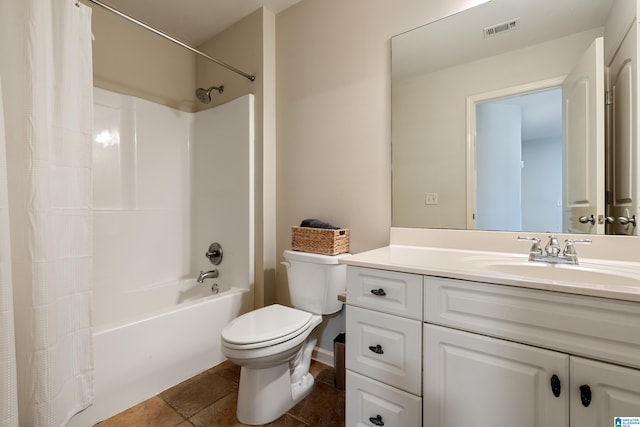 full bathroom featuring vanity, shower / tub combo with curtain, tile patterned floors, and toilet