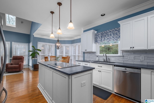 kitchen with a kitchen island, pendant lighting, white cabinetry, dishwasher, and sink