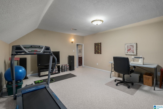 office area featuring lofted ceiling and a textured ceiling