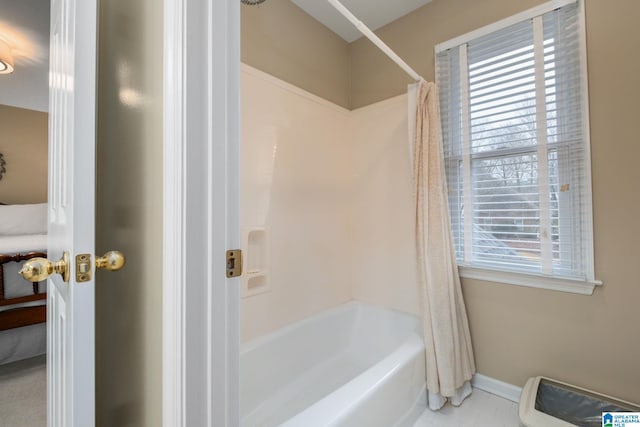 bathroom featuring tile patterned floors and shower / bath combination with curtain