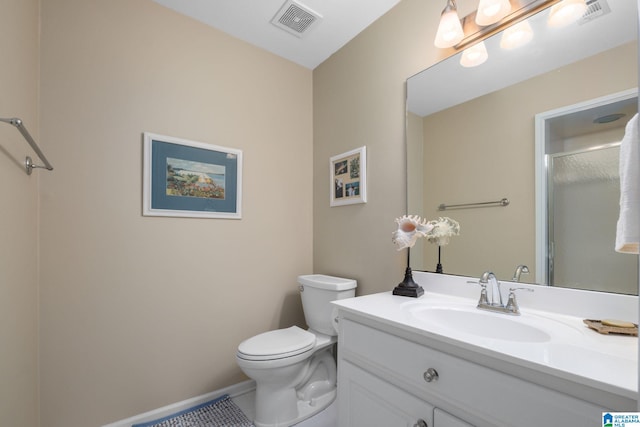 bathroom with vanity, tile patterned floors, and toilet