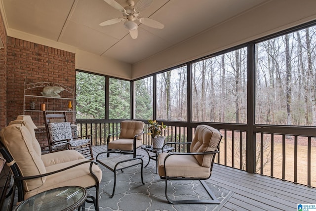 sunroom / solarium featuring ceiling fan and a healthy amount of sunlight