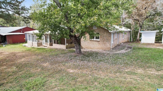 view of yard with a sunroom