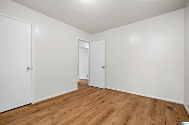 unfurnished bedroom with light hardwood / wood-style flooring