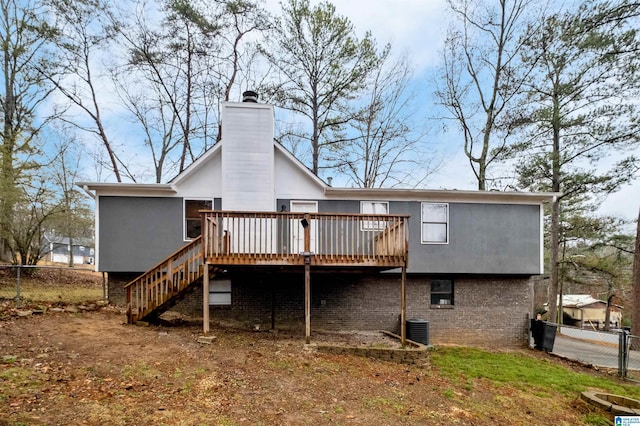 back of house featuring central AC and a deck