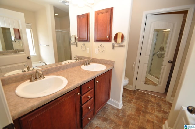 full bathroom with plus walk in shower, vanity, and toilet