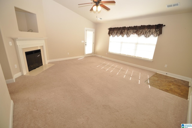 unfurnished living room with carpet, lofted ceiling, and ceiling fan