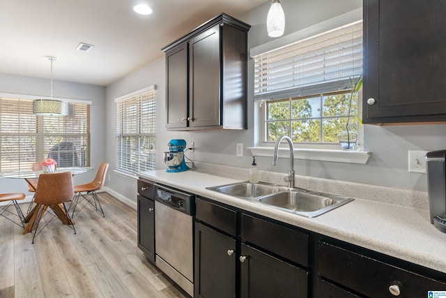 kitchen with dark brown cabinetry, sink, decorative light fixtures, and dishwasher