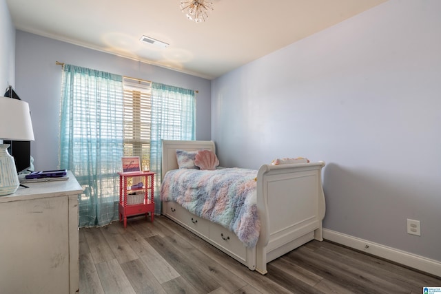 bedroom with light wood-type flooring