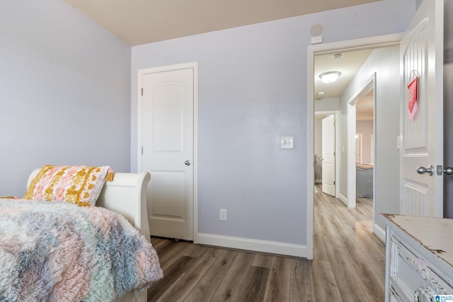 bedroom with light hardwood / wood-style floors