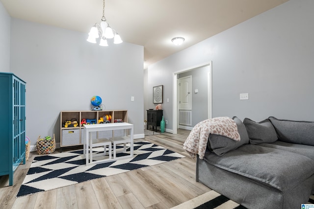 interior space featuring a notable chandelier and light wood-type flooring