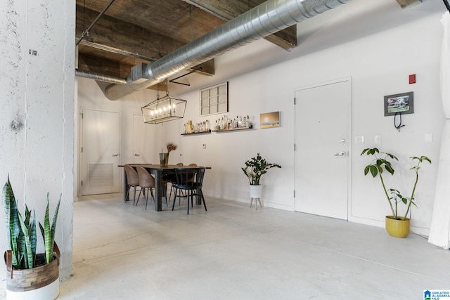 dining room with concrete flooring