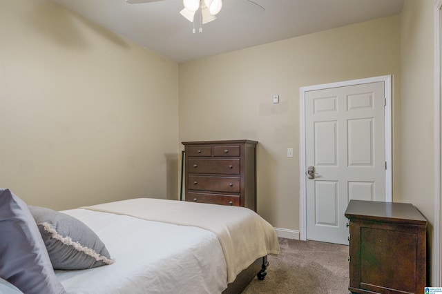 bedroom with baseboards, carpet floors, and a ceiling fan