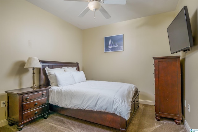 bedroom with baseboards, carpet floors, and a ceiling fan