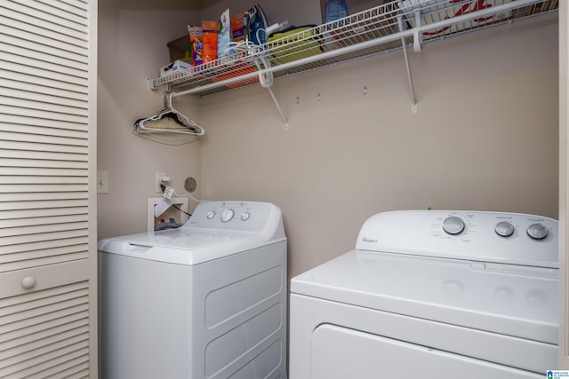 laundry area featuring separate washer and dryer and laundry area