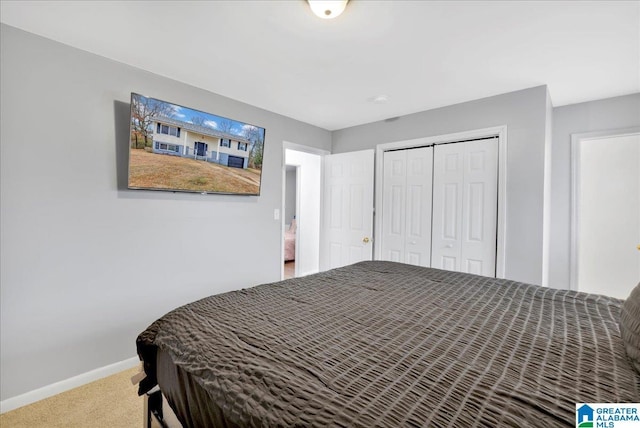 bedroom featuring a closet and carpet