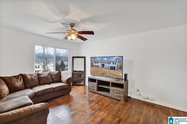 living room with dark wood-type flooring and ceiling fan