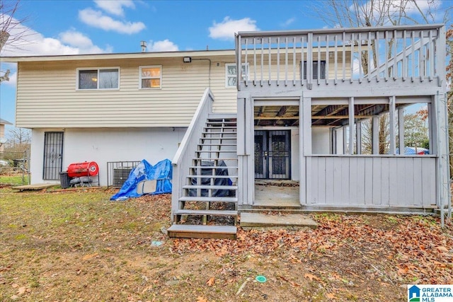 back of property featuring a deck