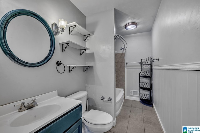 full bathroom with shower / tub combination, vanity, toilet, and tile patterned flooring