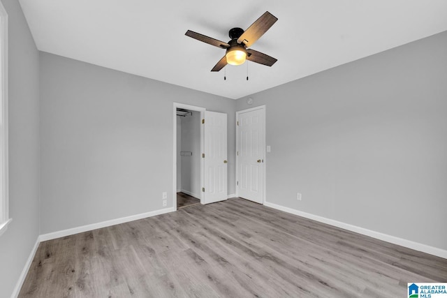 unfurnished bedroom with light wood-type flooring and ceiling fan