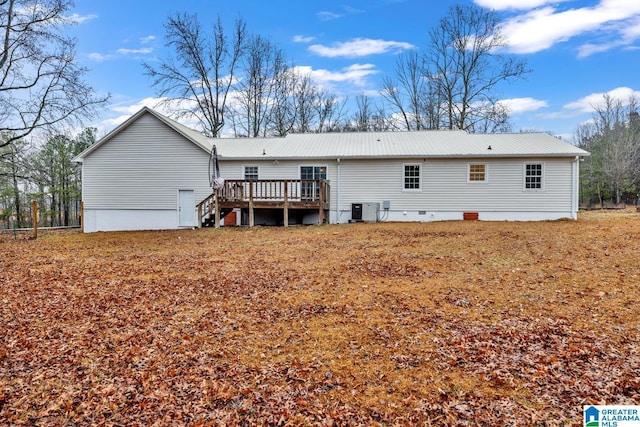 rear view of property featuring a deck and central air condition unit