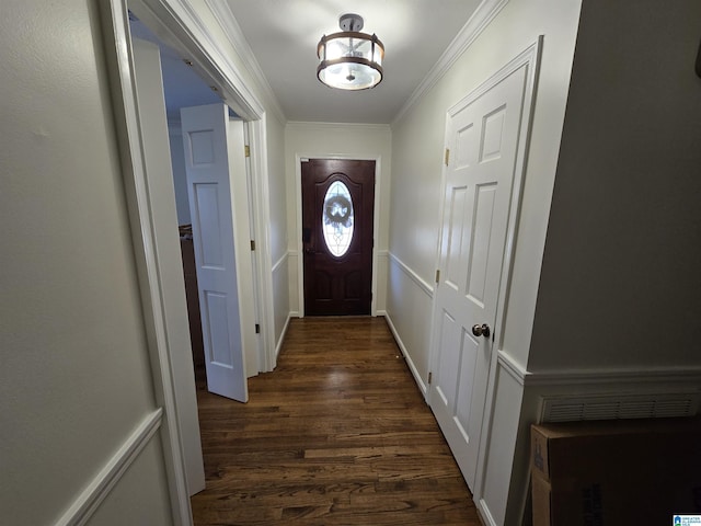 entryway with crown molding and dark hardwood / wood-style floors