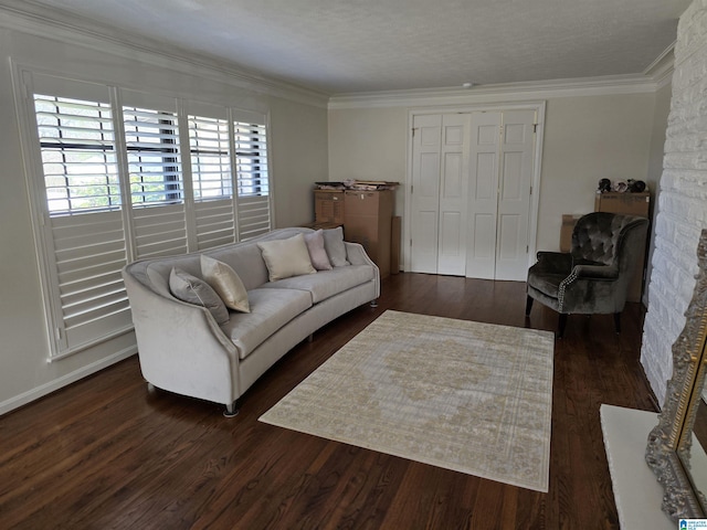 living room with ornamental molding, plenty of natural light, dark hardwood / wood-style floors, and a textured ceiling