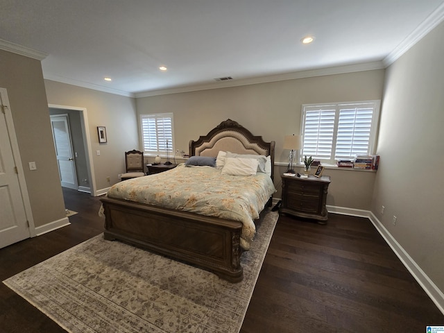 bedroom with dark hardwood / wood-style flooring and ornamental molding