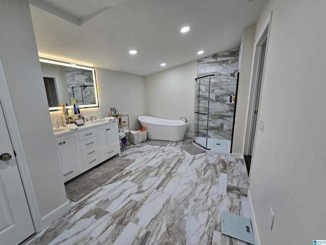 bathroom with vanity and separate shower and tub