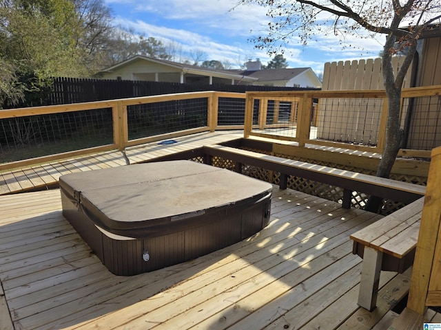 deck with a covered hot tub