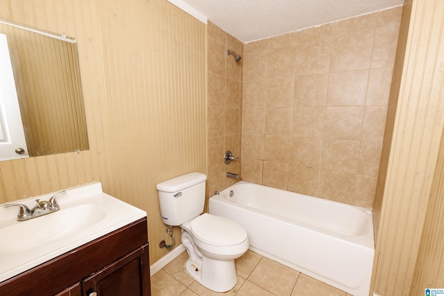 full bathroom with tiled shower / bath, toilet, a textured ceiling, tile patterned floors, and vanity