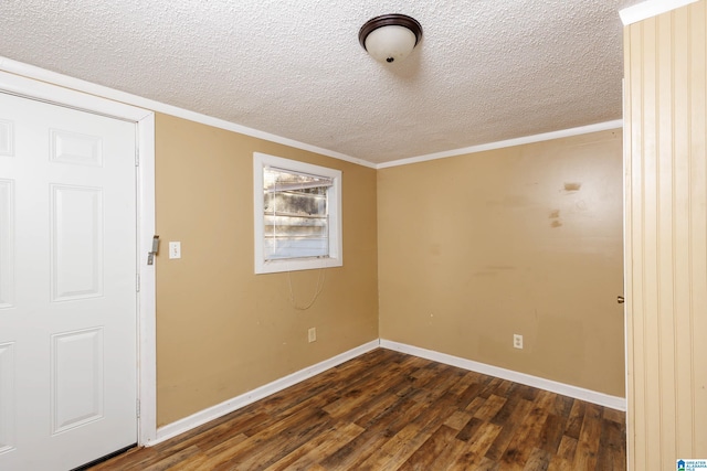 unfurnished room featuring a textured ceiling, dark wood-type flooring, and ornamental molding