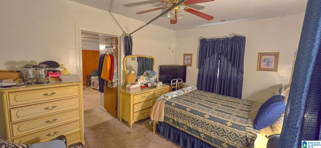 bedroom featuring light carpet and ceiling fan