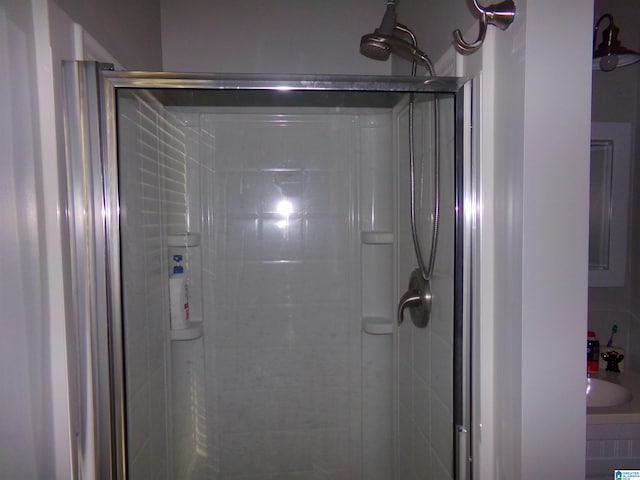 full bath with a shower stall