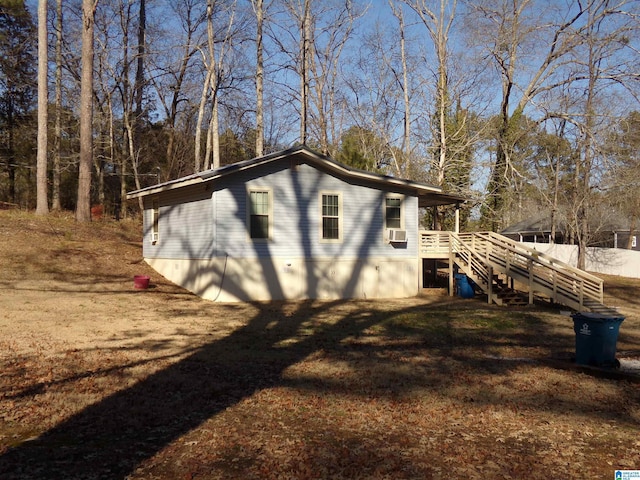 view of outdoor structure with cooling unit and stairs